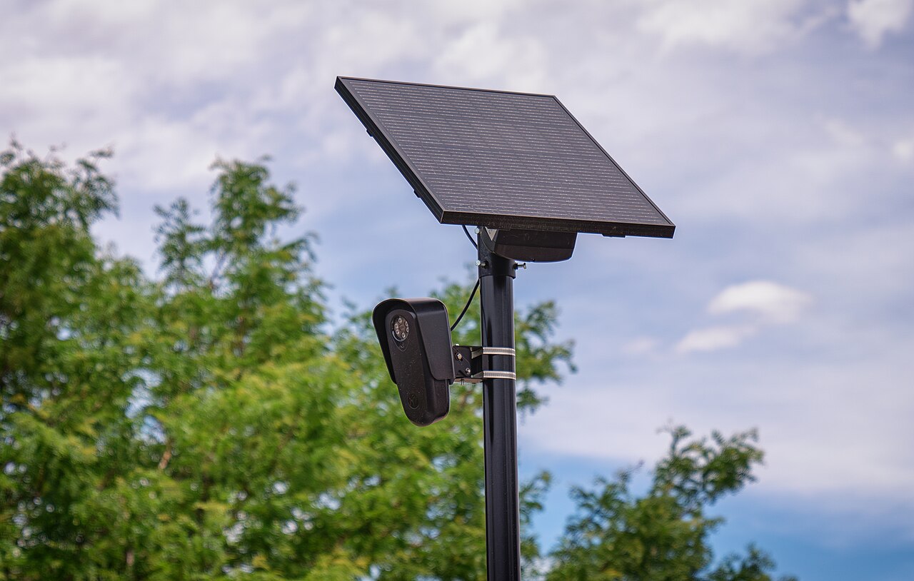 Flock Safety automated license plate reader camera mounted outside a retail store